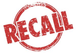 Recall word in red grunge style stamp to illustrate a defect in a product being called back for fix or repair to reduce risk of danger or injury