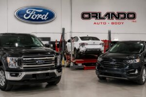 Ford Certified collision repair facility with Ford vehicles inside Orlando Auto Body repair shop