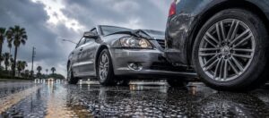 Arizona monsoon season collision on a wet roadway showing two vehicles involved in a fender bender