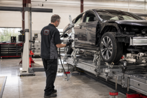 Orlando Auto Body technician using Spanesi structural measuring equipment during a collision repair in Arizona.
